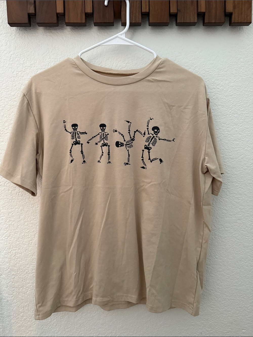 Beige Short-Sleeve Tee with Dancing Skeleton Graphic